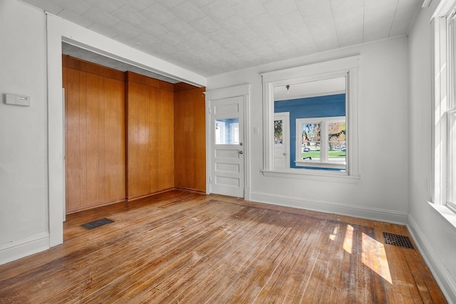 305 Pierson Ave, New Richmond, WI 54017 - foyer with hardwood / wood-style flooring and baseboards