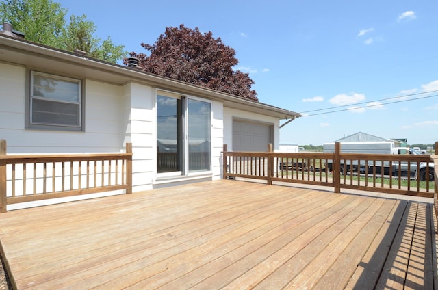 wooden deck with a garage