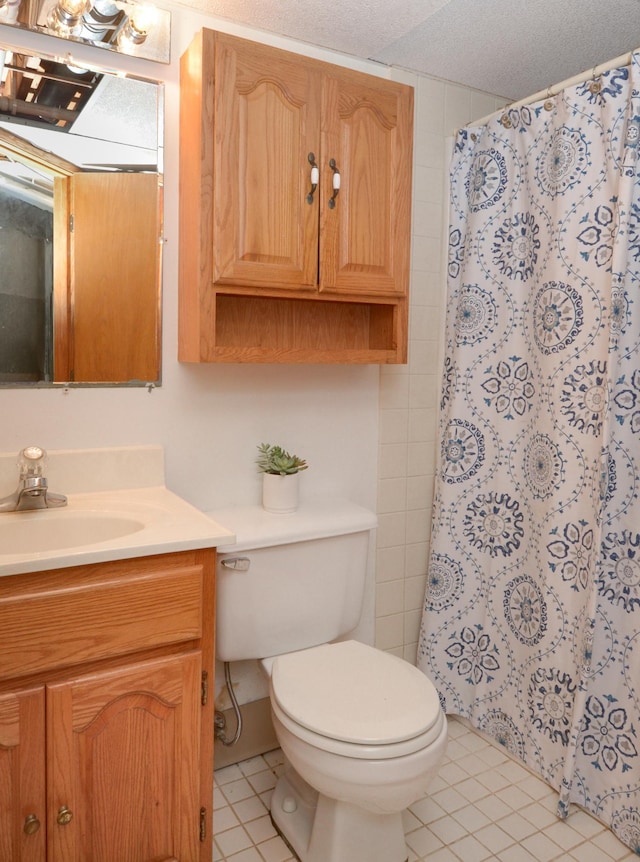 full bath featuring toilet, vanity, a shower with curtain, and tile patterned flooring