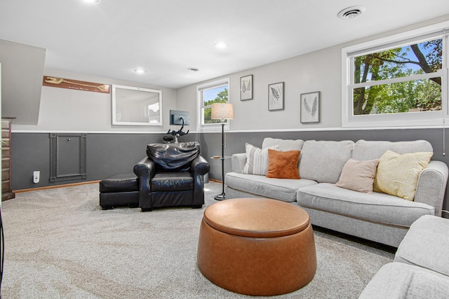 carpeted living room featuring plenty of natural light and recessed lighting