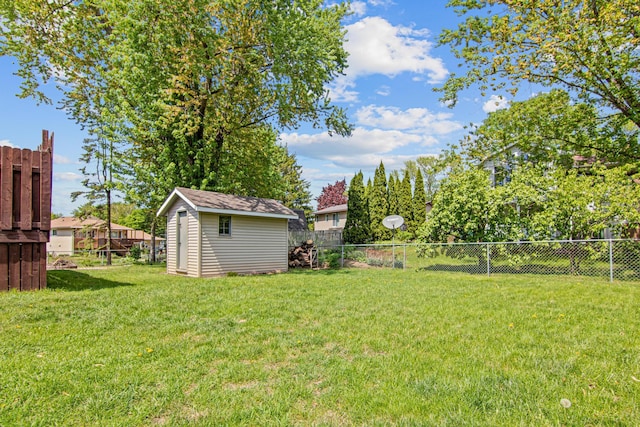 view of yard with a storage shed and an outbuilding