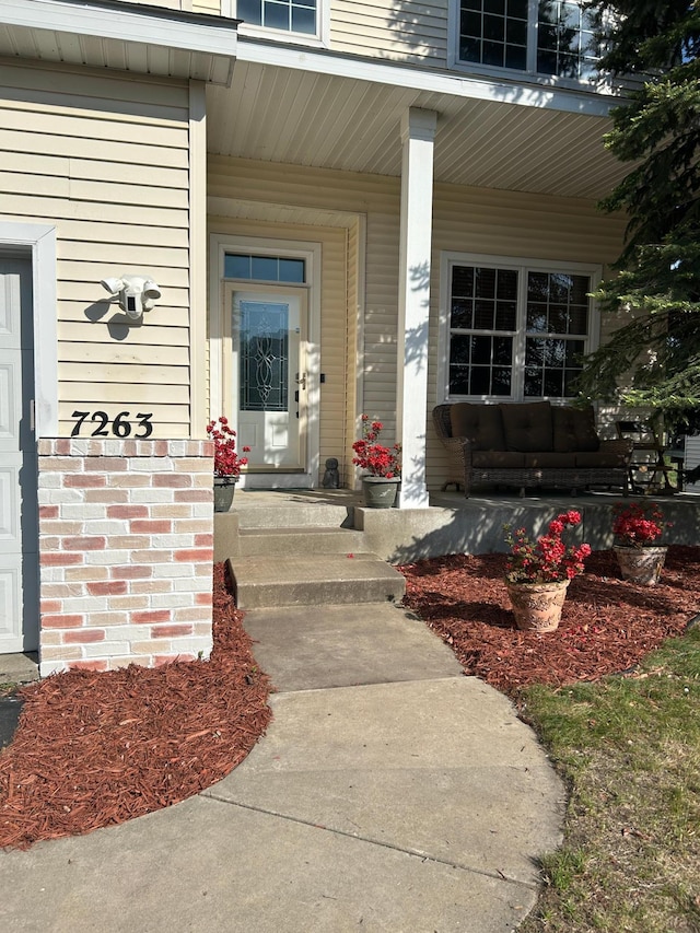 7263 Falmouth Curv, Shakopee, MN 55379 - doorway to property featuring covered porch