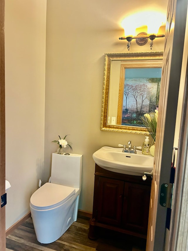 7263 Falmouth Curv, Shakopee, MN 55379 - bathroom featuring vanity, wood finished floors, toilet, and baseboards