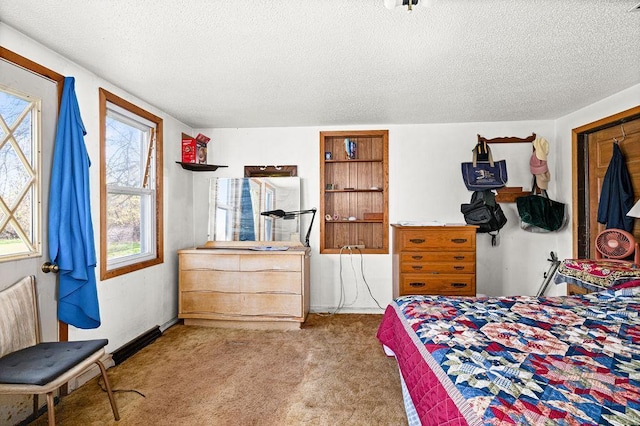 carpeted bedroom with a textured ceiling