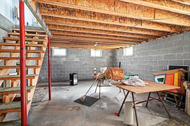 basement featuring stairs and healthy amount of natural light
