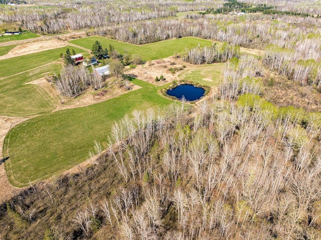 aerial view of property and surrounding area with a large body of water