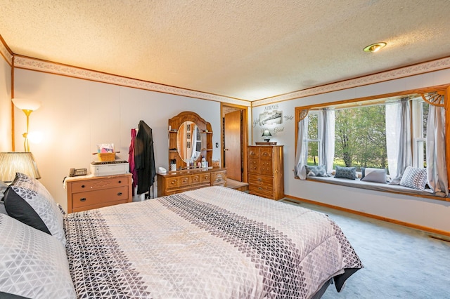 carpeted bedroom with a textured ceiling, crown molding, and baseboards