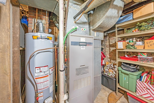 utility room featuring water heater