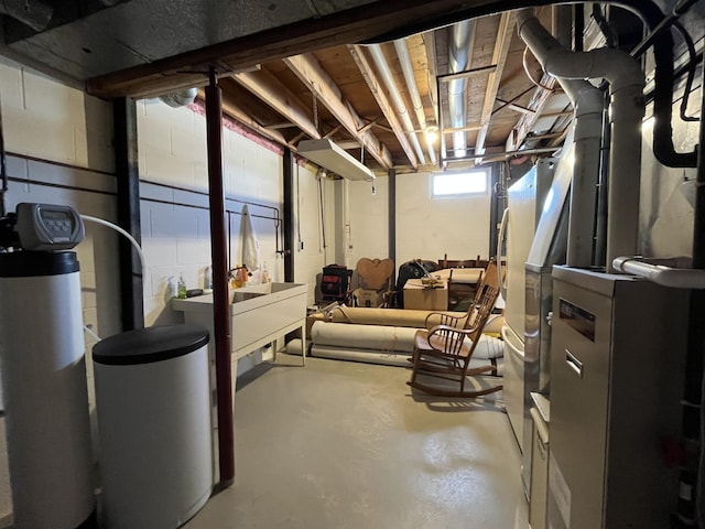 basement featuring concrete block wall