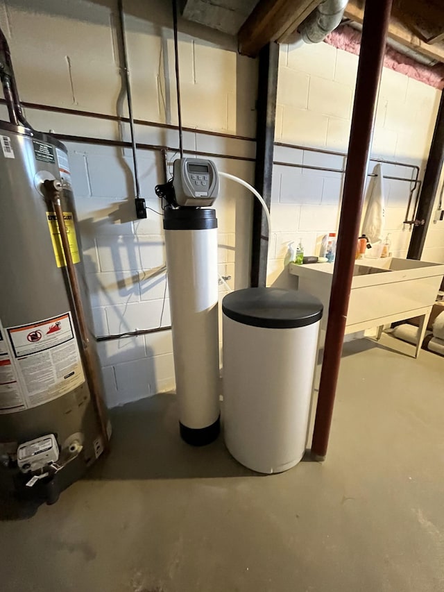 utility room with gas water heater