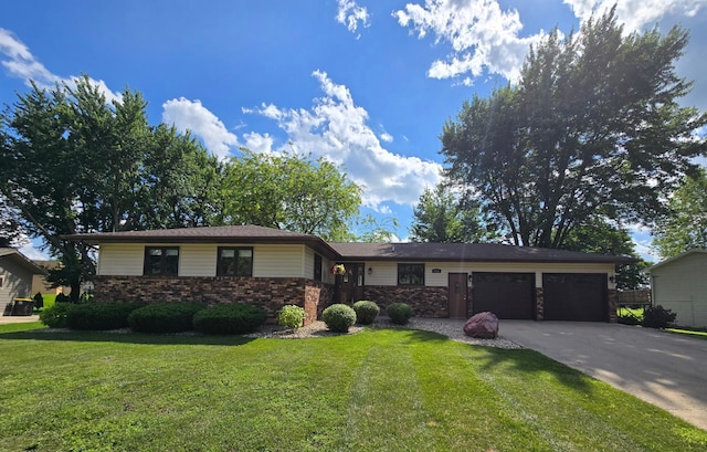 1085 20th St, Windom, MN 56101 - view of front of home with a garage, a front lawn, driveway, and brick siding