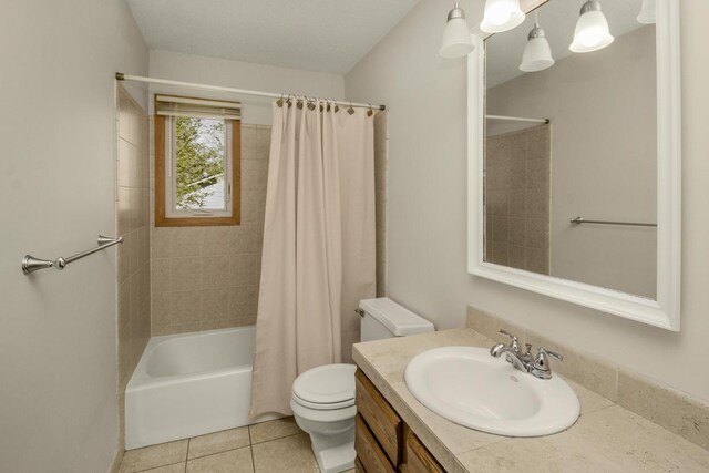 13056 Euclid Ave, Apple Valley, MN 55124 - full bath featuring vanity, shower / tub combo with curtain, and tile patterned floors