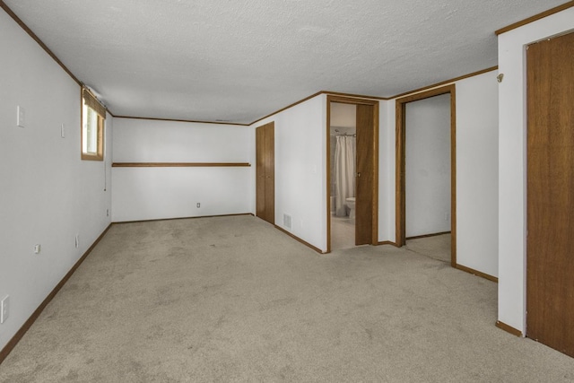 13056 Euclid Ave, Apple Valley, MN 55124 - unfurnished bedroom with carpet flooring, a textured ceiling, ensuite bathroom, and crown molding