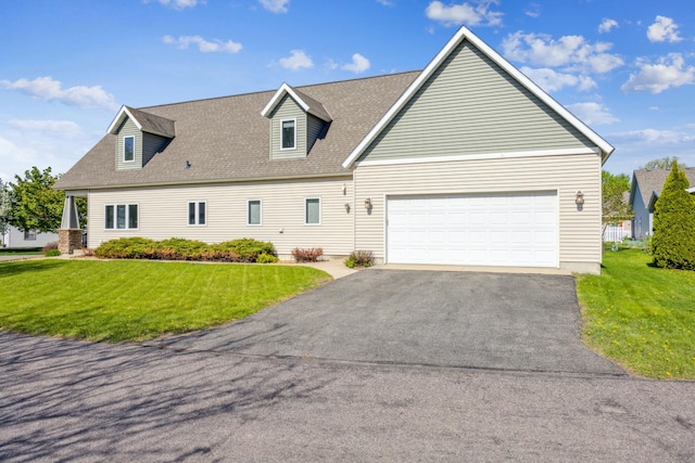 173 Cardinal Ln, Clearwater, MN 55320 - view of front of home featuring asphalt driveway, a front yard, an attached garage, and a shingled roof