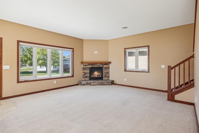 173 Cardinal Ln, Clearwater, MN 55320 - unfurnished living room with light carpet, plenty of natural light, stairway, and baseboards