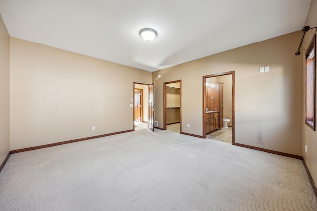 173 Cardinal Ln, Clearwater, MN 55320 - unfurnished bedroom with light colored carpet, a walk in closet, and baseboards