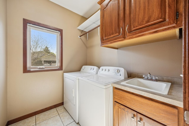 173 Cardinal Ln, Clearwater, MN 55320 - washroom featuring cabinet space, washer and dryer, baseboards, and light tile patterned floors