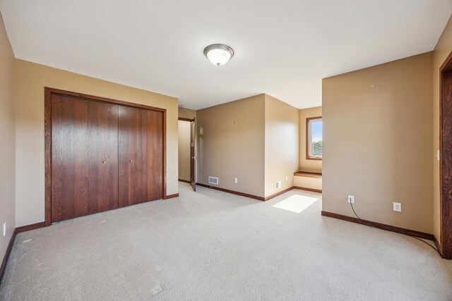 173 Cardinal Ln, Clearwater, MN 55320 - unfurnished bedroom with light colored carpet, baseboards, and a closet
