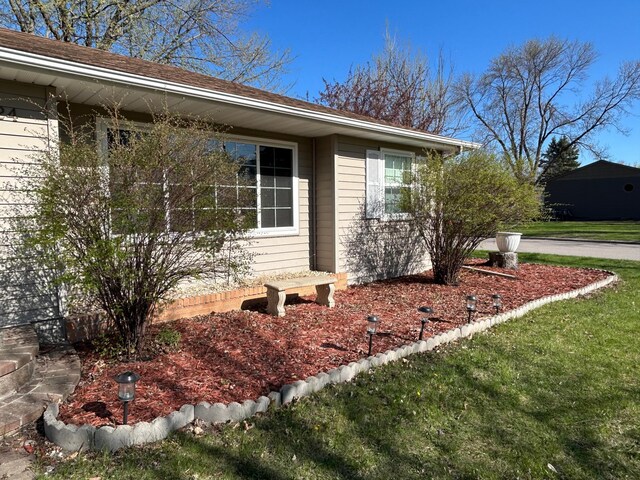 view of home's exterior with a lawn