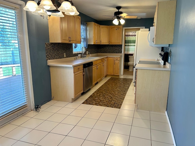 324 Maple Ave S, Thief River Falls, MN 56701 - kitchen featuring a sink, stainless steel dishwasher, light countertops, a ceiling fan, and a chandelier