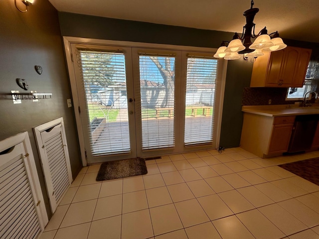 324 Maple Ave S, Thief River Falls, MN 56701 - kitchen featuring healthy amount of natural light, dishwasher, a chandelier, and light countertops