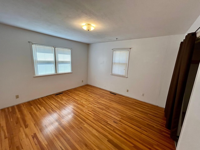 324 Maple Ave S, Thief River Falls, MN 56701 - empty room with light wood finished floors