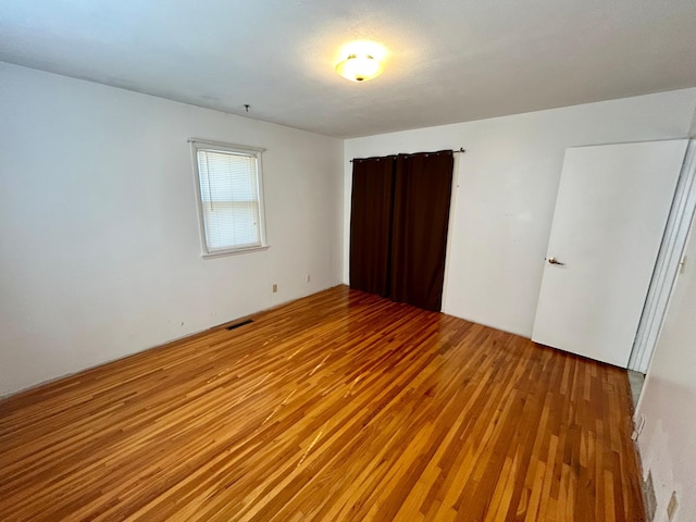 324 Maple Ave S, Thief River Falls, MN 56701 - unfurnished bedroom featuring wood-type flooring