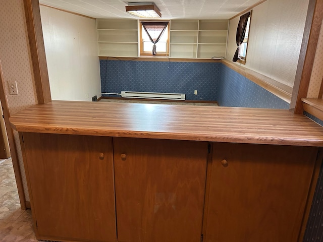 324 Maple Ave S, Thief River Falls, MN 56701 - kitchen featuring wallpapered walls, baseboard heating, and open shelves