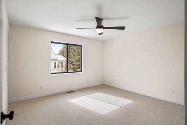 2140 Arkwright St, Maplewood, MN 55117 - unfurnished room with carpet, a ceiling fan, and baseboards