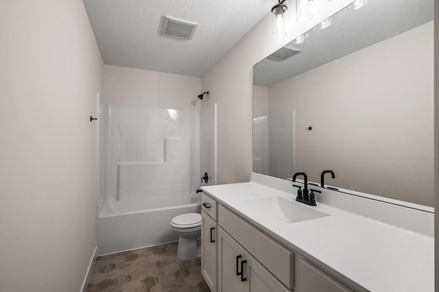 full bath featuring toilet, vanity, shower / washtub combination, a textured ceiling, and baseboards