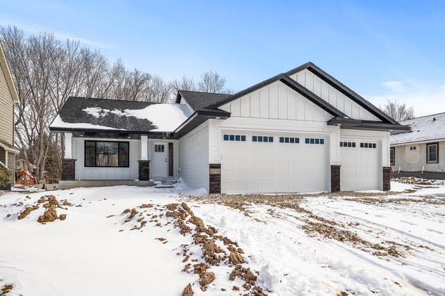 view of front of house with board and batten siding and an attached garage
