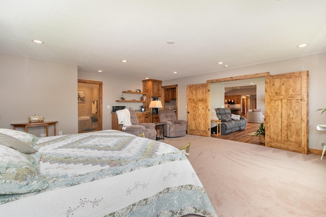 27667 Bay Shore Dr NW, Isanti, MN 55040 - carpeted bedroom with recessed lighting and ensuite bath