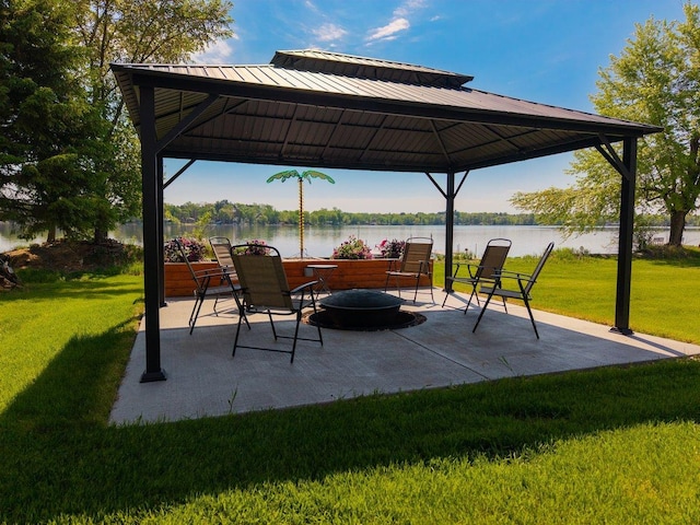 27667 Bay Shore Dr NW, Isanti, MN 55040 - view of patio featuring a gazebo, a fire pit, and a water view