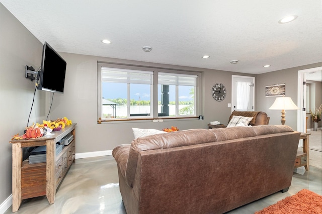 27667 Bay Shore Dr NW, Isanti, MN 55040 - living area with recessed lighting, baseboards, and a textured ceiling