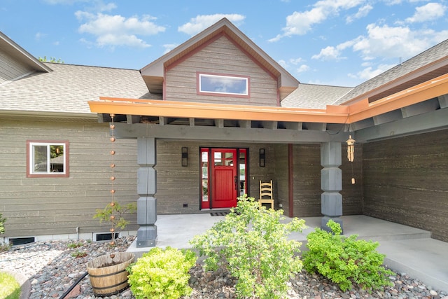 27667 Bay Shore Dr NW, Isanti, MN 55040 - doorway to property featuring a shingled roof, a porch, driveway, and an attached garage