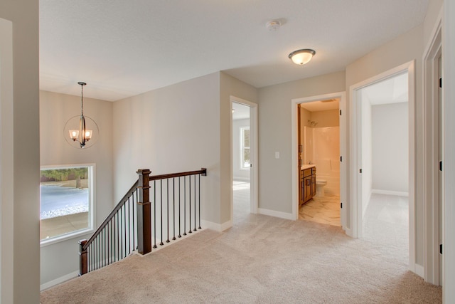 8683 Peony Ln N, Maple Grove, MN 55311 - corridor featuring an upstairs landing, light colored carpet, a chandelier, and baseboards