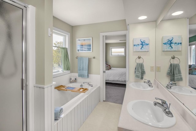 5057 Linden Trl N, Lake Elmo, MN 55042 - full bathroom featuring ensuite bathroom, a garden tub, double vanity, recessed lighting, and a shower with shower door