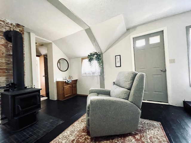 506 2nd St S, Tower, MN 55790 - living area with a wood stove, dark wood-type flooring, and lofted ceiling