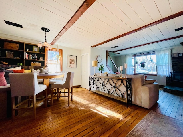 506 2nd St S, Tower, MN 55790 - dining space with wood-type flooring, stairs, a chandelier, and wood ceiling with exposed beams