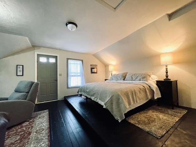 506 2nd St S, Tower, MN 55790 - bedroom with vaulted ceiling and dark wood finished floors