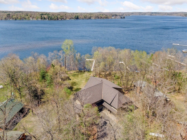 aerial view of property and surrounding area featuring a large body of water