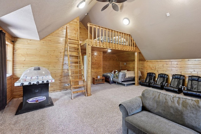 carpeted bedroom with wood walls, lofted ceiling, and a textured ceiling