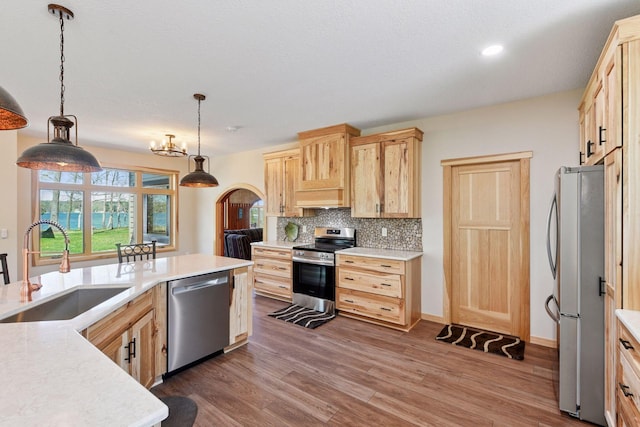 2273 Woodland Shrs Unit A, Luck, WI 54853 - kitchen featuring stainless steel appliances, a sink, light brown cabinetry, light countertops, and recessed lighting