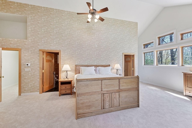 2273 Woodland Shrs Unit A, Luck, WI 54853 - bedroom with high vaulted ceiling, light carpet, baseboards, and a ceiling fan
