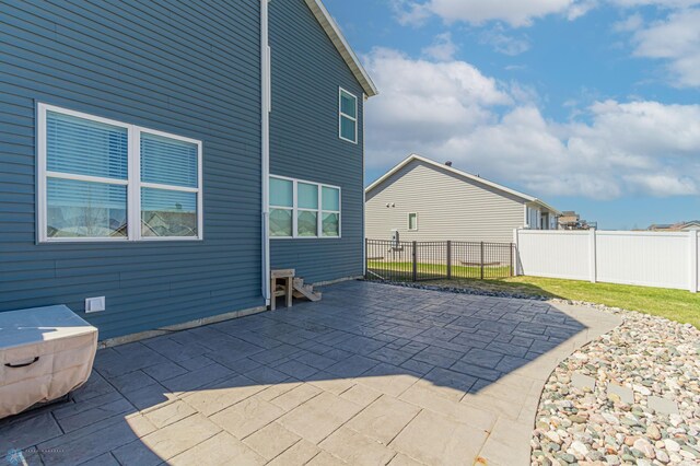 view of patio featuring fence