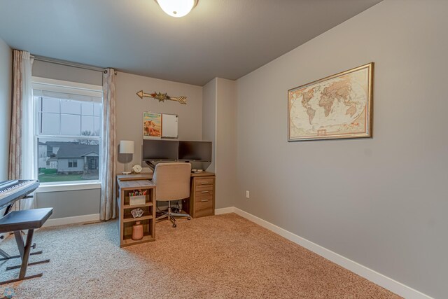 home office featuring carpet and baseboards