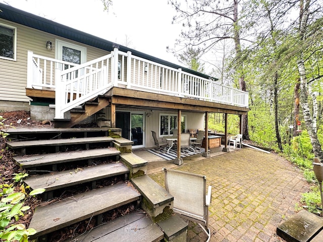 23479 State 200, Itasca Twp, MN 56676 - rear view of property with a deck, a patio area, and stairs