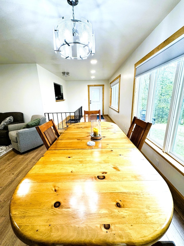 23479 State 200, Itasca Twp, MN 56676 - dining space featuring a chandelier and wood finished floors