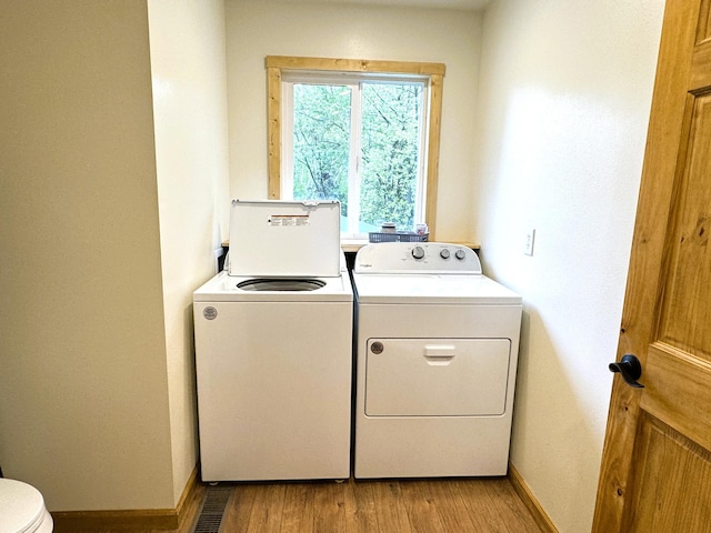 23479 State 200, Itasca Twp, MN 56676 - laundry room featuring washer and dryer, light wood-style flooring, and baseboards