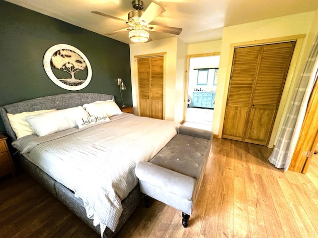 23479 State 200, Itasca Twp, MN 56676 - bedroom featuring two closets, wood-type flooring, and ceiling fan